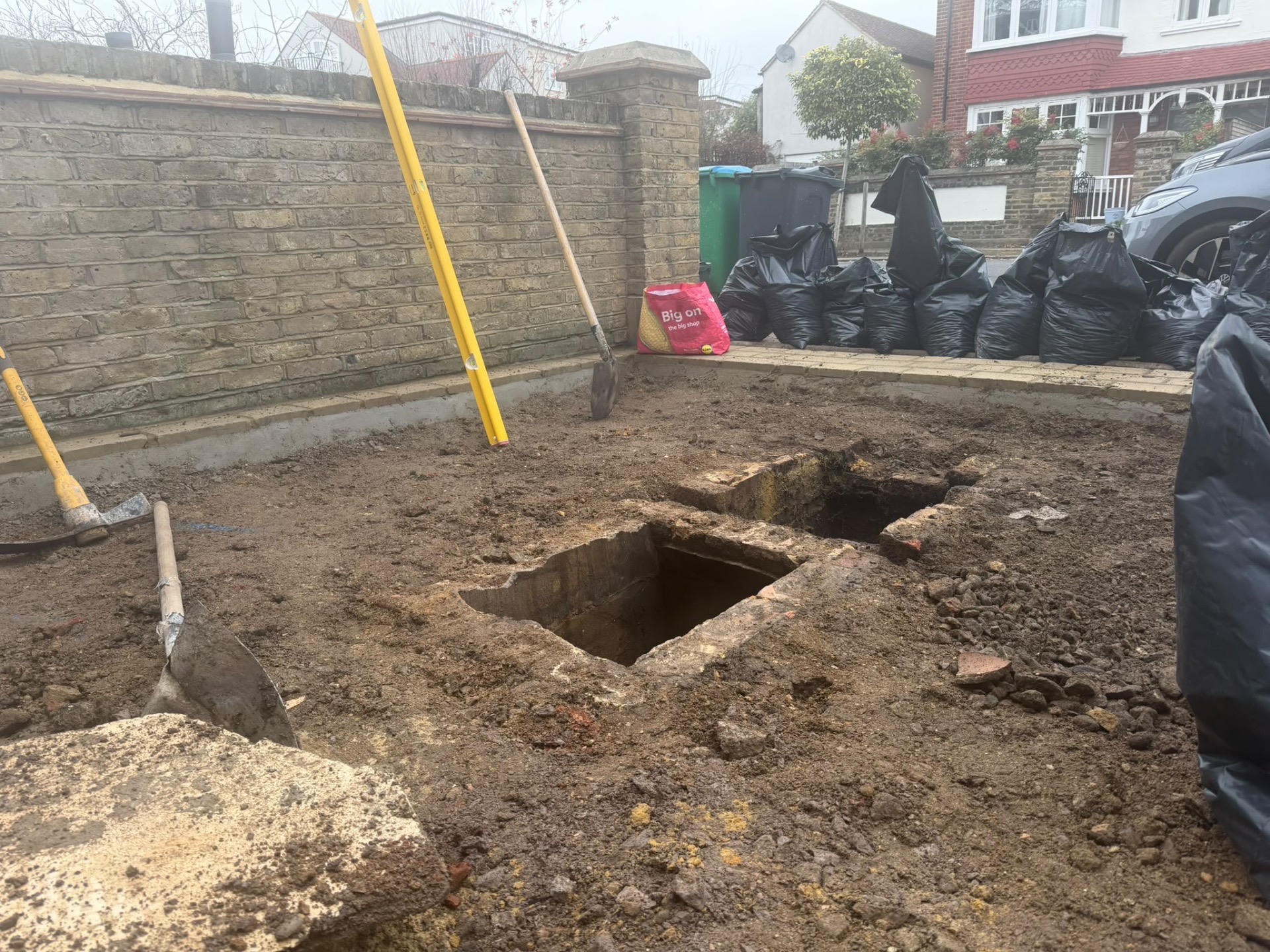 Excavated front garden at the start of groundworks, before the new driveway was built