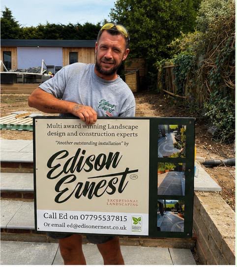 Ed presenting the Edison Ernest site signboard during the build
